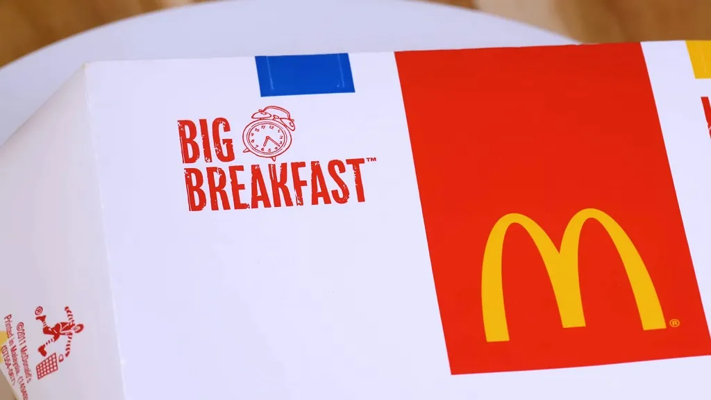 A McDonald's Big Breakfast box with the logo and design prominently displayed on a table