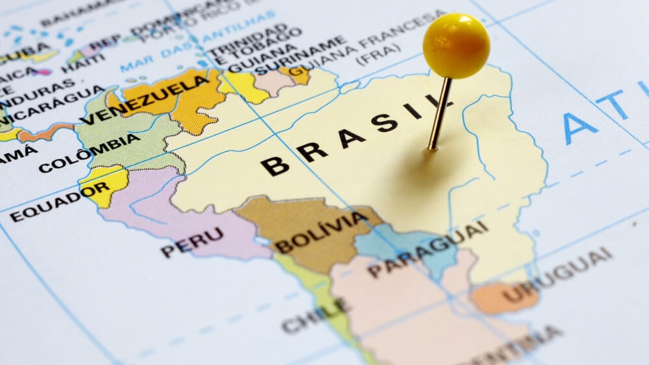 Map of South America with a pin marking Brazil, highlighting all the countries that border Brazil