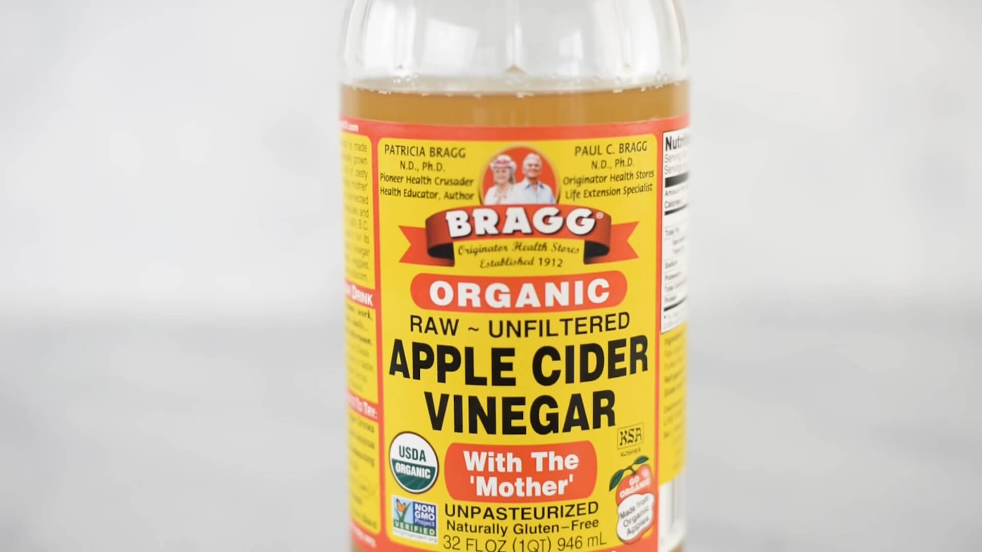 A bottle of apple cider vinegar on the table