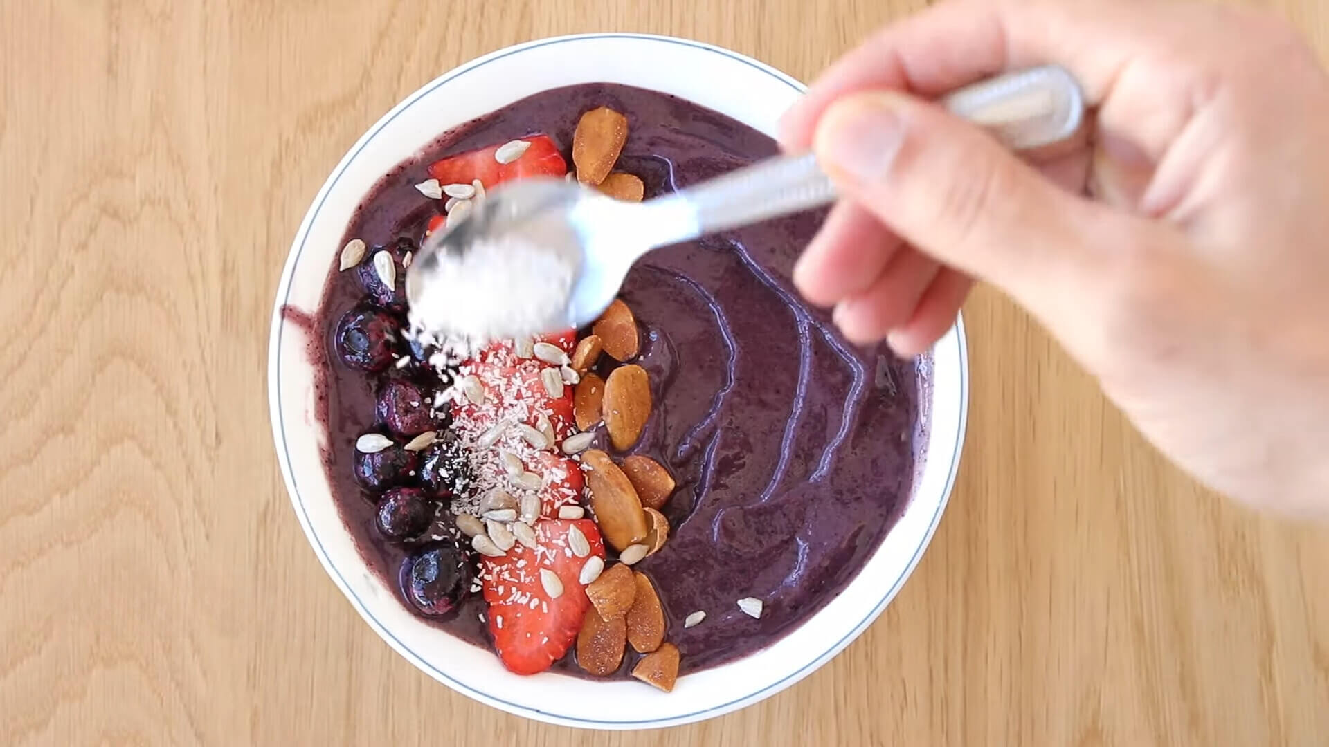 Coconut flakes as a topping for an Açaí bowl