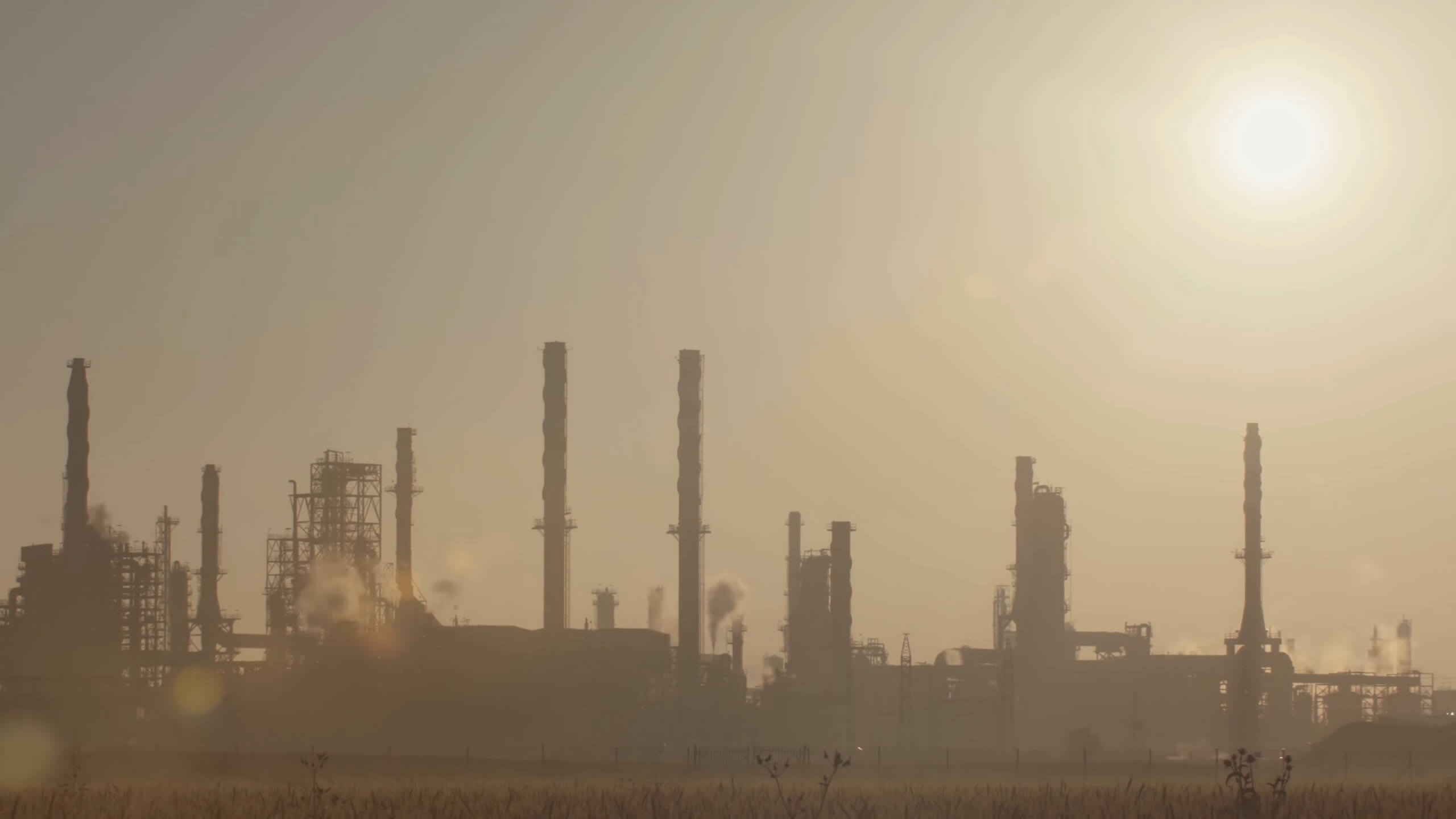 The silhouette of an oil refinery