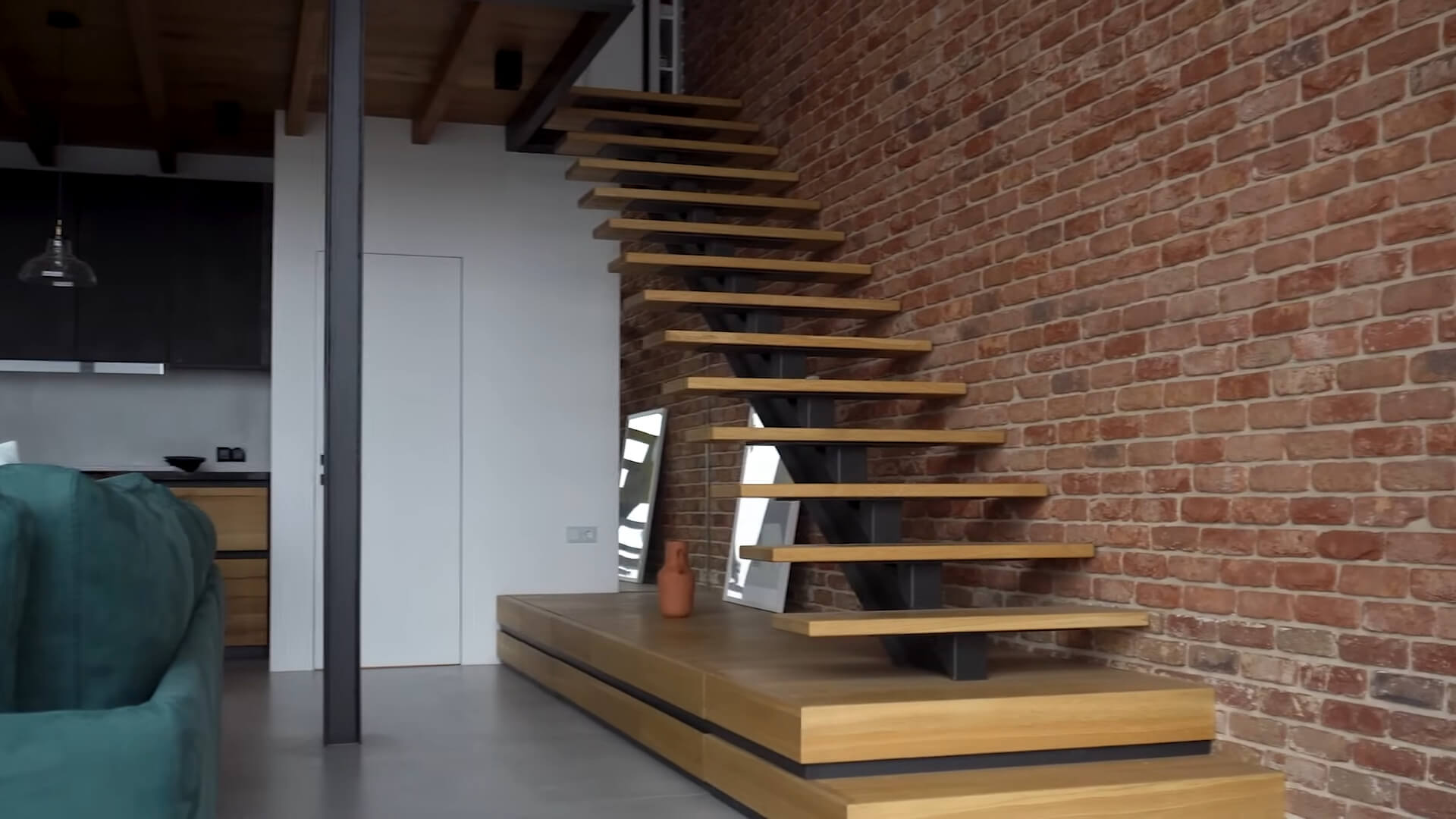 Loft-style living space with red brick walls