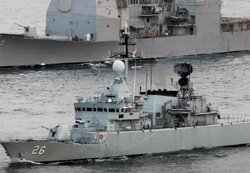 A Kasturi-class corvette in front of a Keris-class littoral mission ship