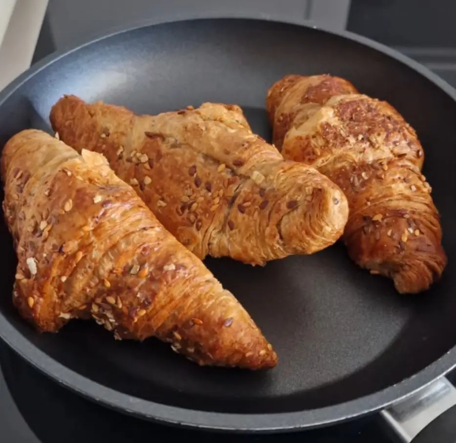 Reheating three croissants on the stovetop