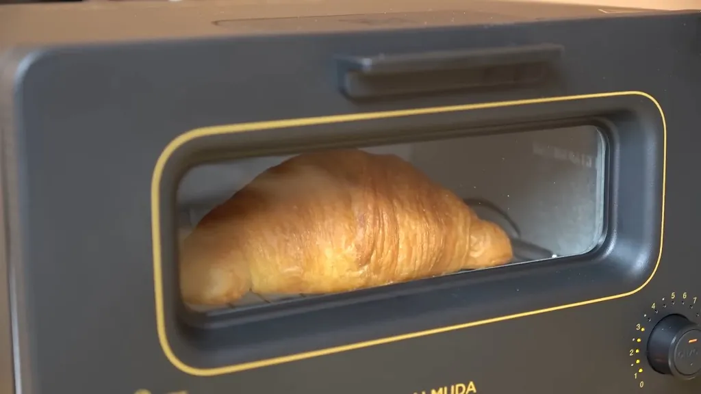 Golden-baked croissant in a toaster oven