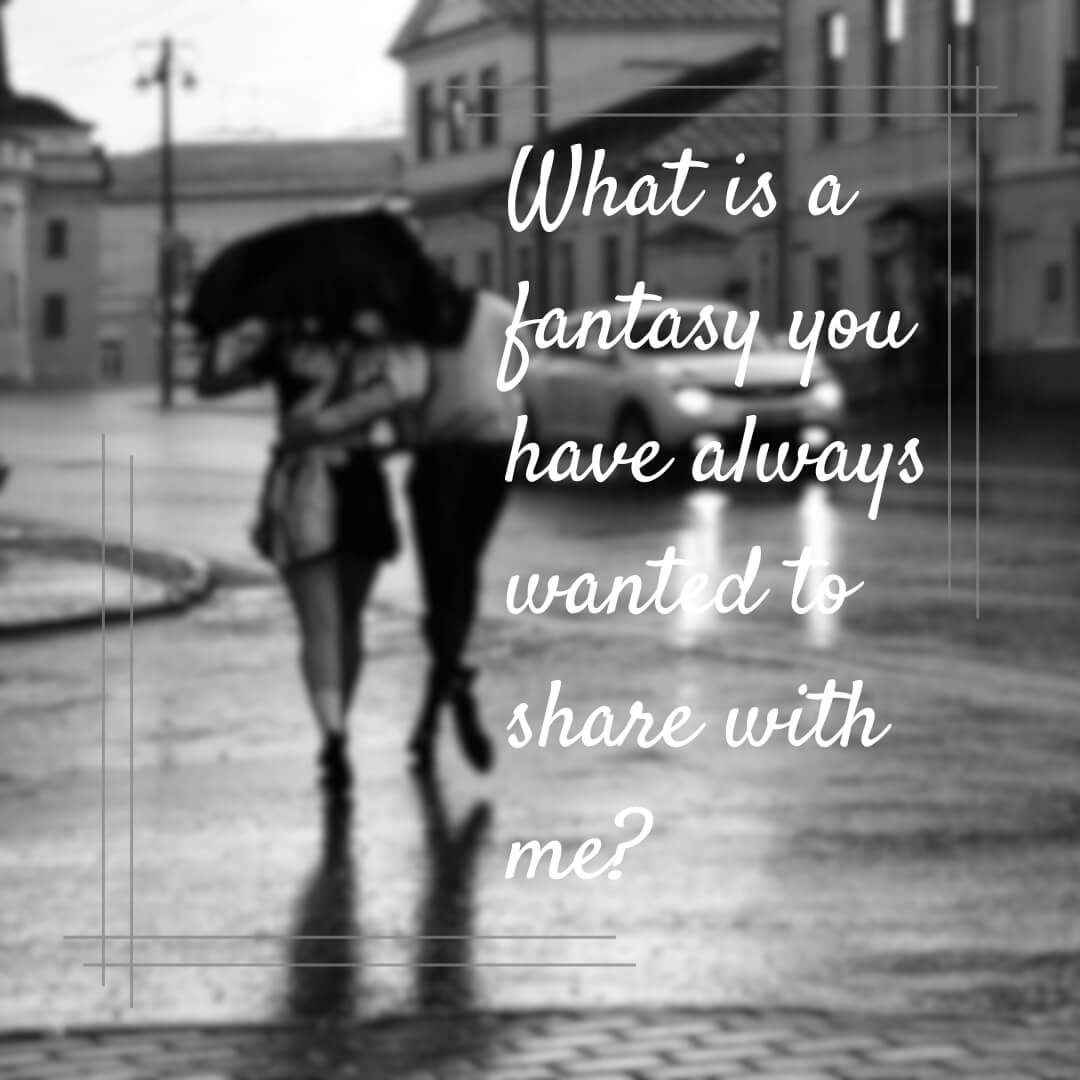 A black-and-white image of a couple walking under an umbrella on a rainy evening