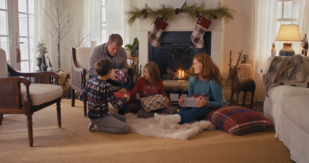 Family members exchanging gifts with each other for Christmas