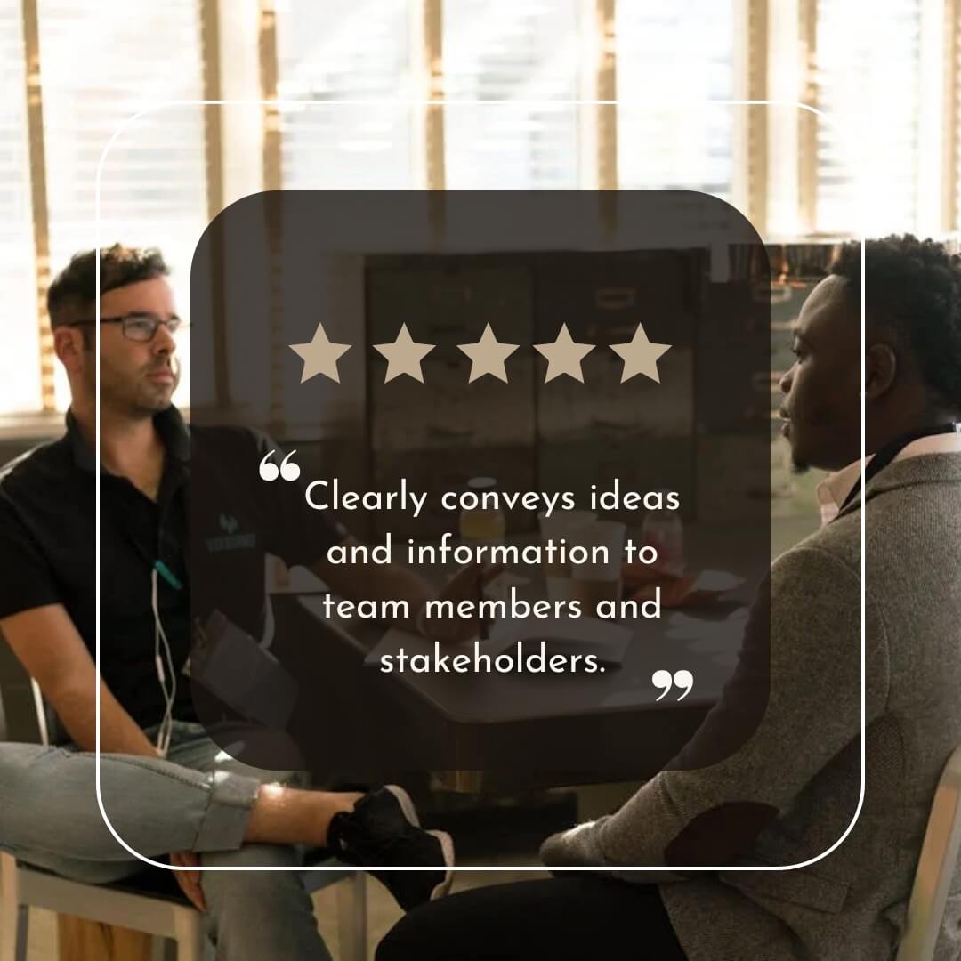 Two colleagues sitting in a meeting room having a focused discussion