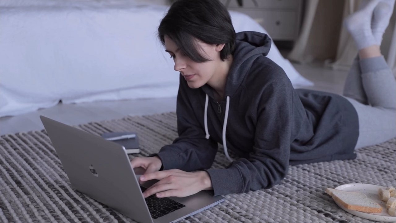 Woman booking a hotel room from her laptop