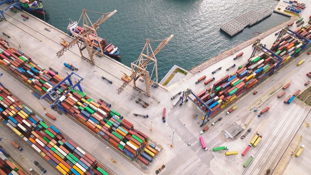 Gantry crane at the port loading containers onto a ship