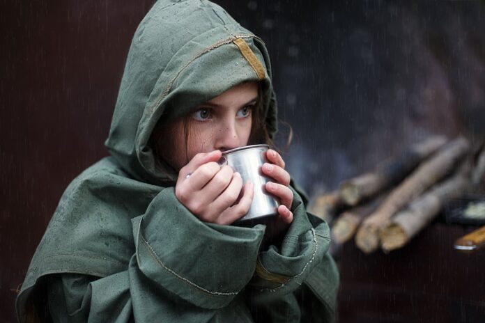 A Woman Drinking Peppermint tea to relax.