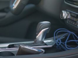 Dark interior of the Nissan Altima, with a metallic gear shift